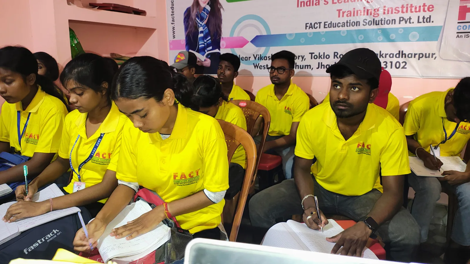 Students learning computer education and digital skills in a computer lab